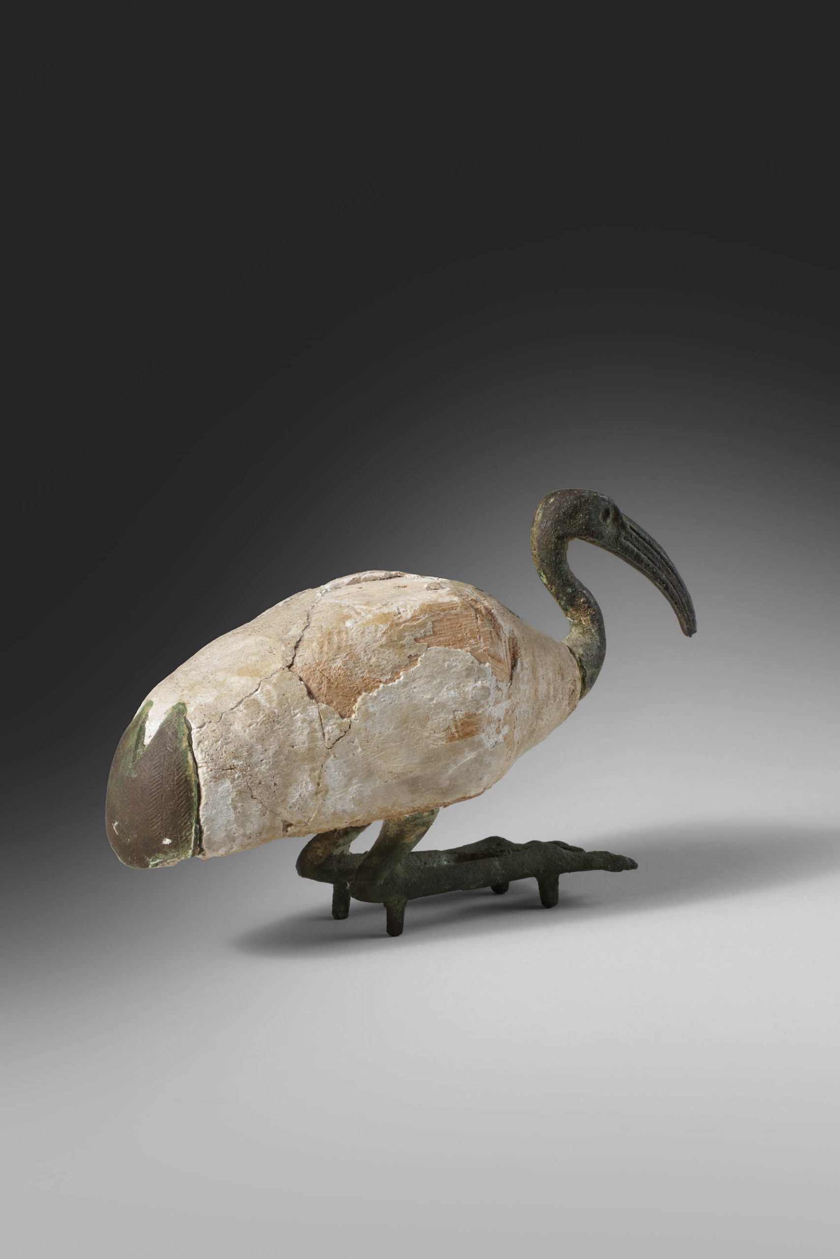 WOOD FIGURE OF SQUATTING IBIS