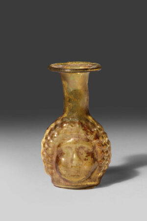 BROWNISH GLASS JANIFORM HEAD FLASK