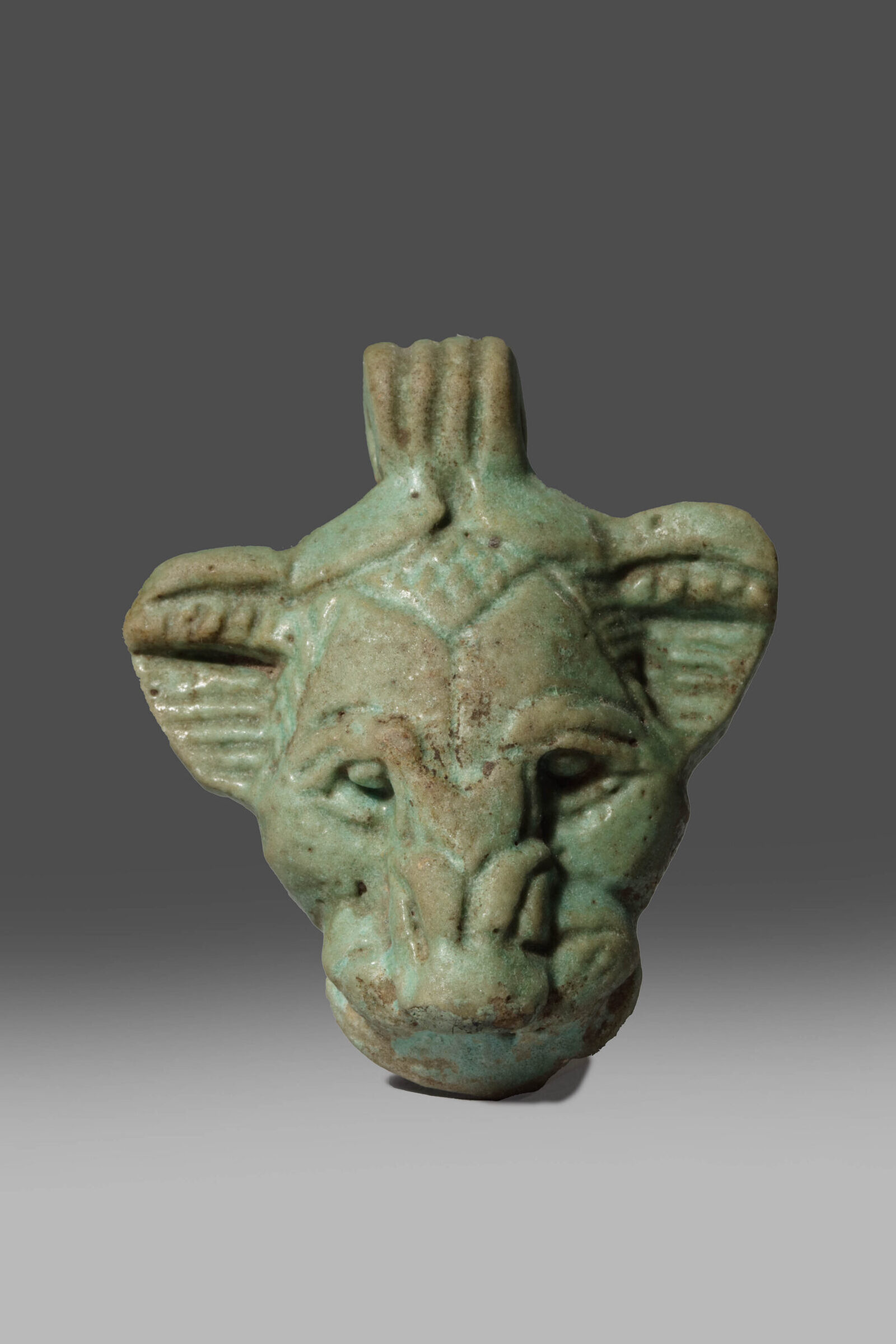 BLUE GREEN FAIENCE LION’S FACE PENDANT