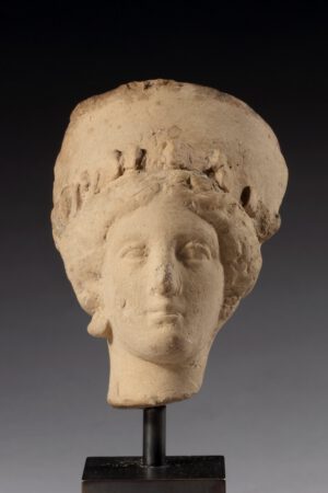 HELLENISTIC TERRACOTTA FEMALE HEAD
